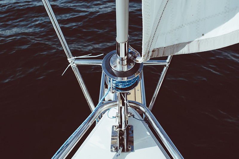 Sailboat mast with ocean underneath