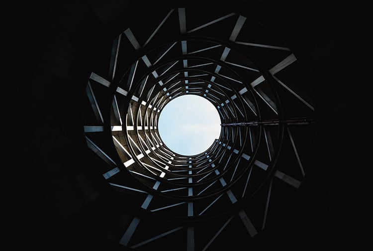 city architecture with sky opening at the top